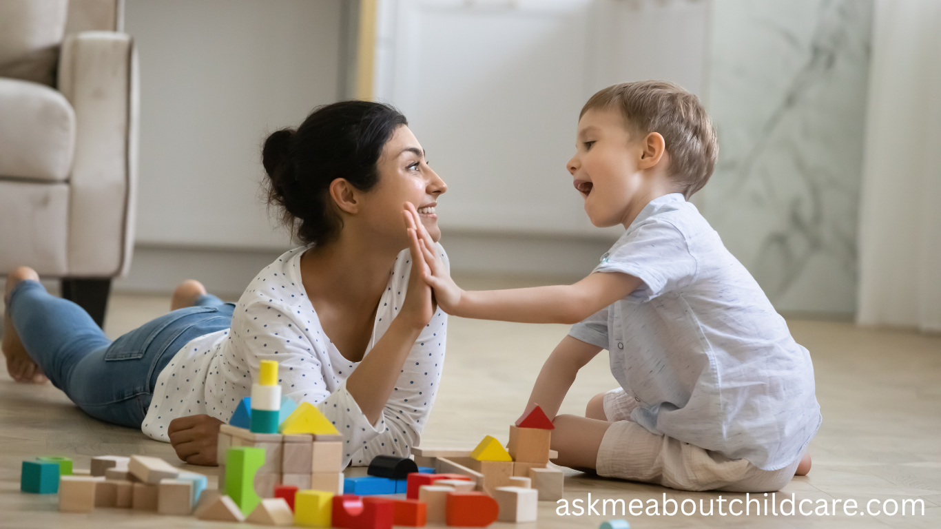 A woman and young boy playing with wooden blocks at home